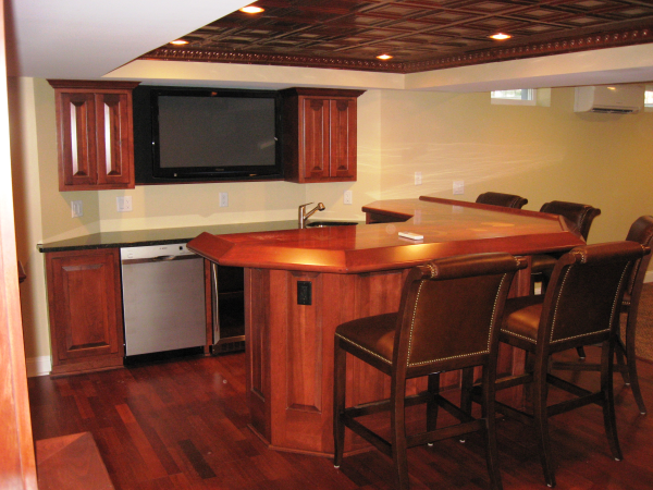 Sports bar version of a remodeled basement in Bolton